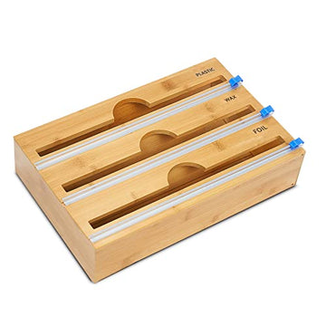 Bamboo cutting board with compartments for plastic, wax paper, and foil on a white background